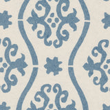 Detail of wallpaper in a damask stripe print in blue on a cream field.