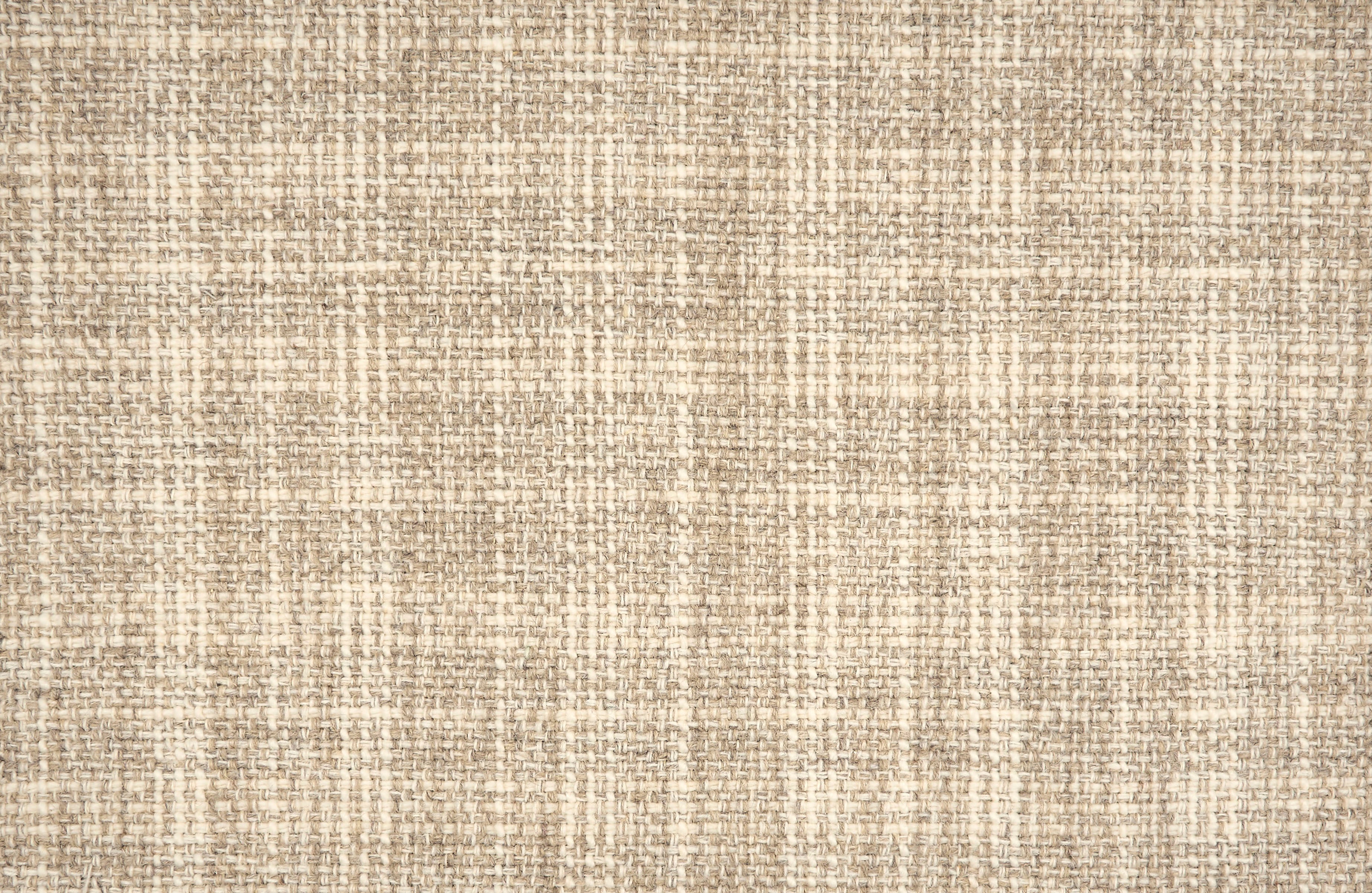 Broadloom carpet in a strié basketweave pattern in cream and beige.