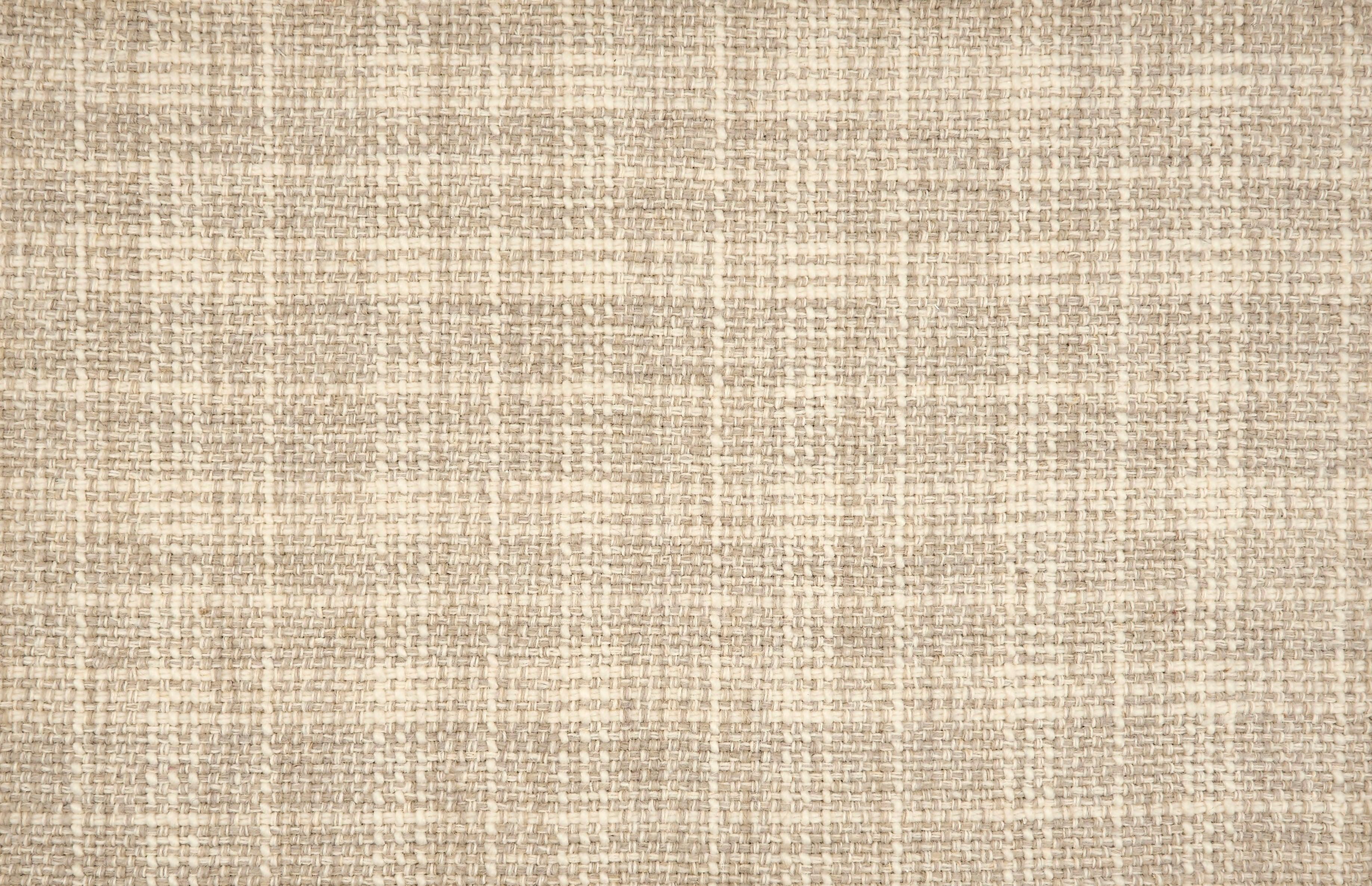 Broadloom carpet in a strié basketweave pattern in cream and taupe.