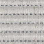 Broadloom carpet detail in a oatmeal field with a blue dotted stripe.