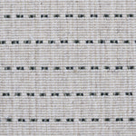 Broadloom carpet detail in a oatmeal field with a forest green stripe.