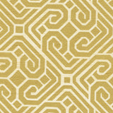 Detail of fabric in a geometric lattice print in gold on a cream field.