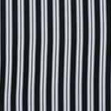 Striped performance fabric in white on black.