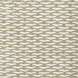 Fabric in a repeating abstract print in cream on a tan field.
