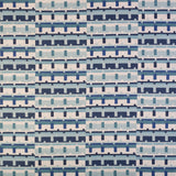 Detail of fabric in a playful geometric grid print in shades of blue, navy and white.