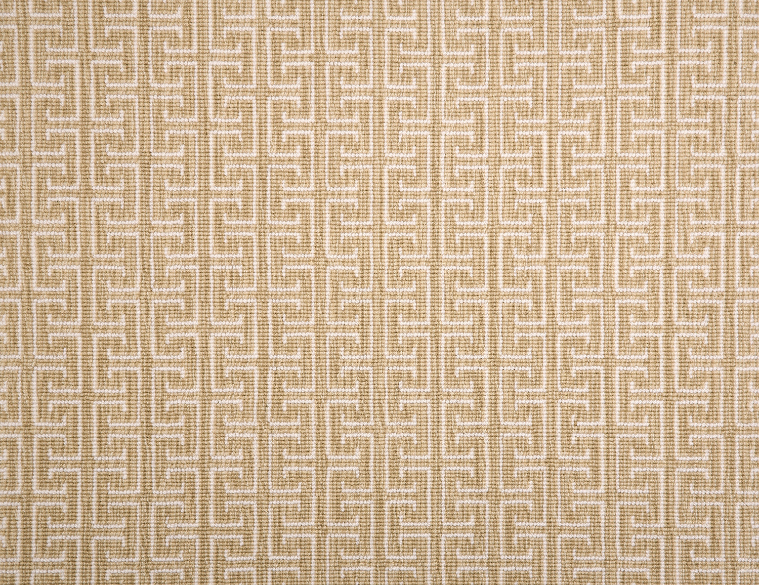 Broadloom carpet with geometric Greek pattern in ivory on tan.