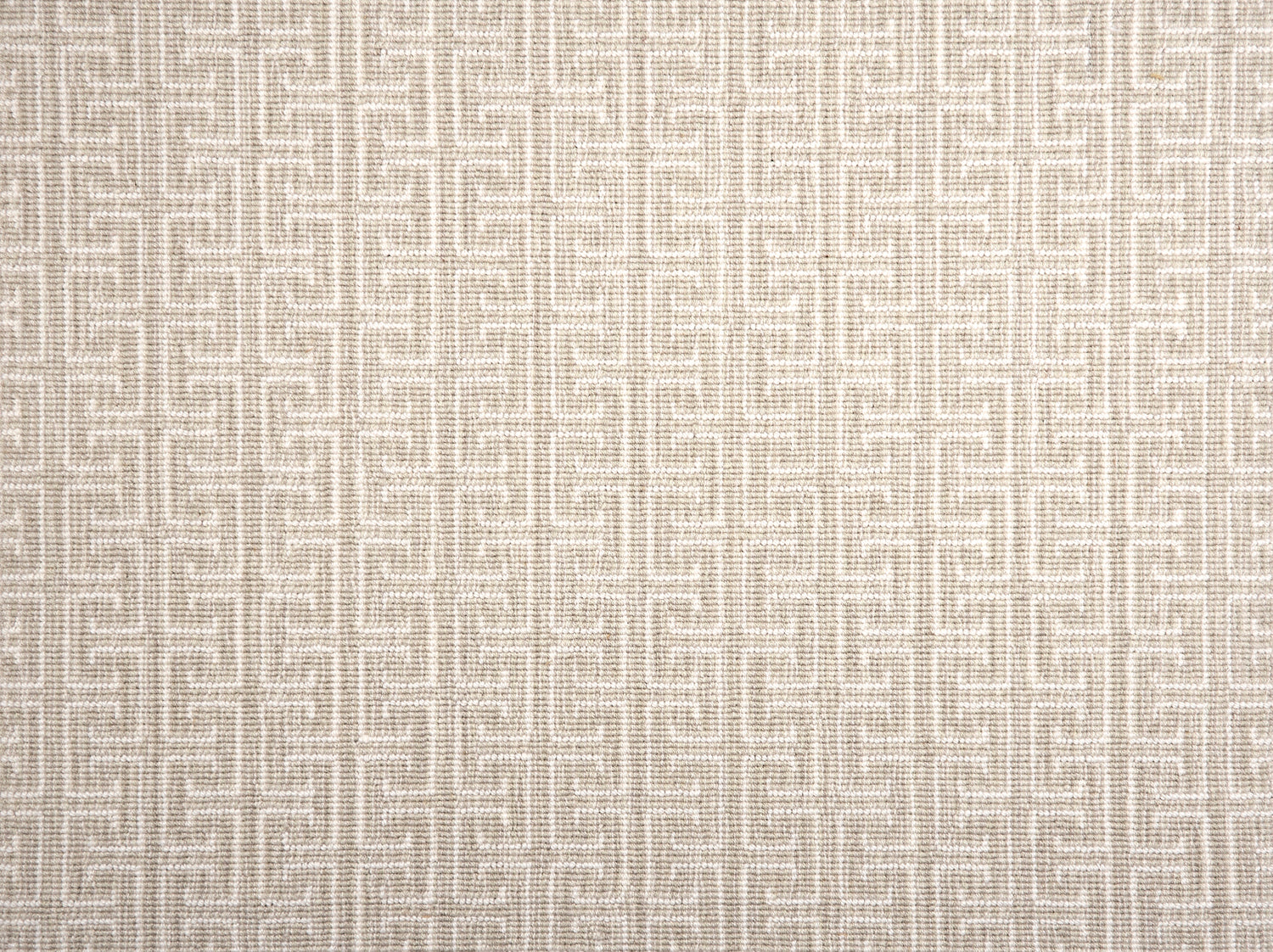 Broadloom carpet with geometric Greek pattern in ivory on ecru.