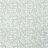 Detail of fabric in a dense paisley print in white on a gray-blue field.