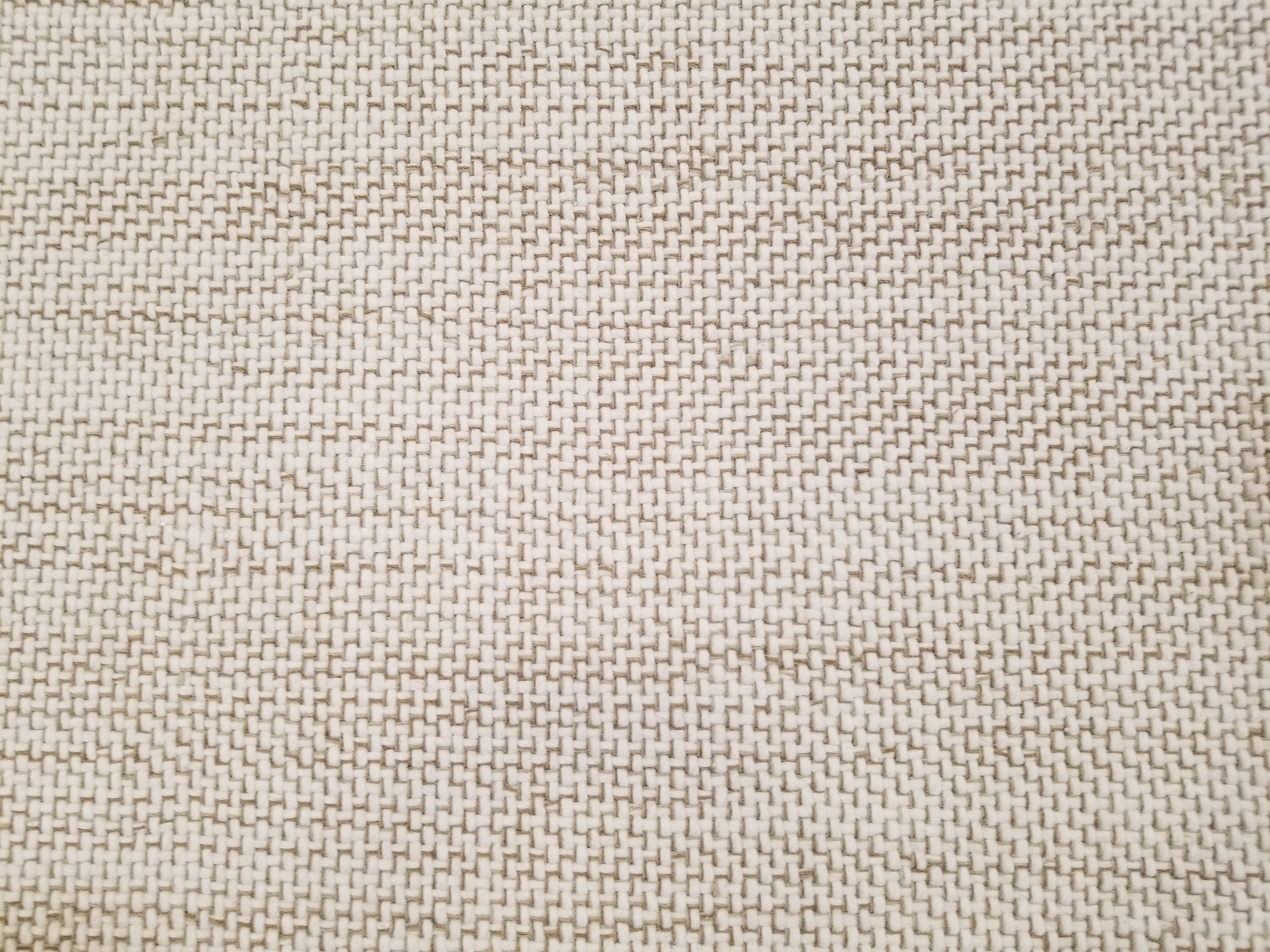 Berlin rug in textural design in tan and white stitching