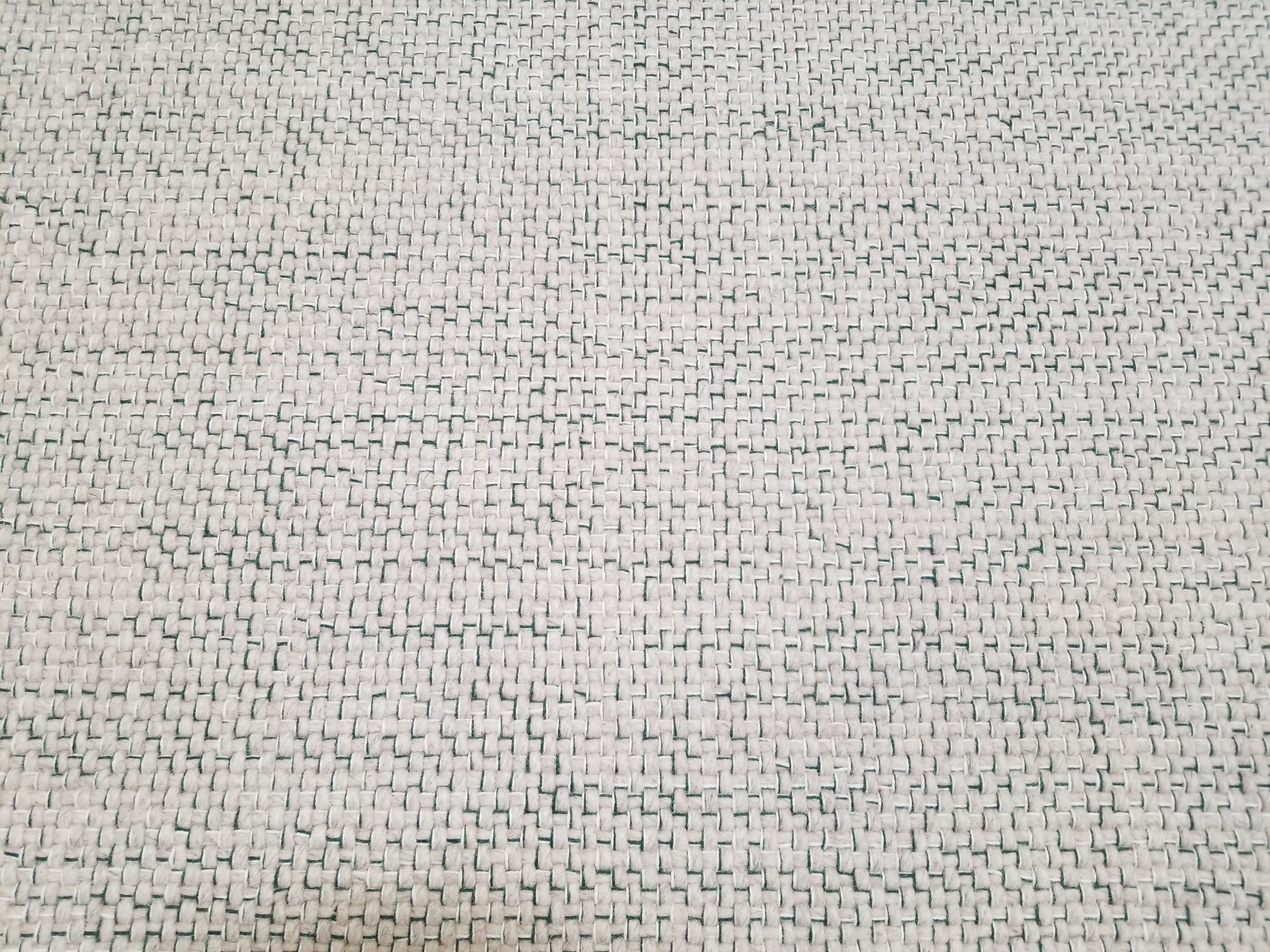 Berlin rug in textural design in beige and dark green stitching