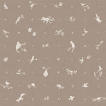 Detail of fabric in a playful animal and branch print in cream on a brown field.