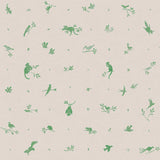 Detail of fabric in a playful animal and branch print in green on a tan field.