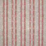 Detail of fabric in a dense tribal stripe pattern in shades of cream, pink and olive green. 