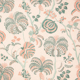 Detail of fabric in a floral paisley in shades of pink and green on a cream field.
