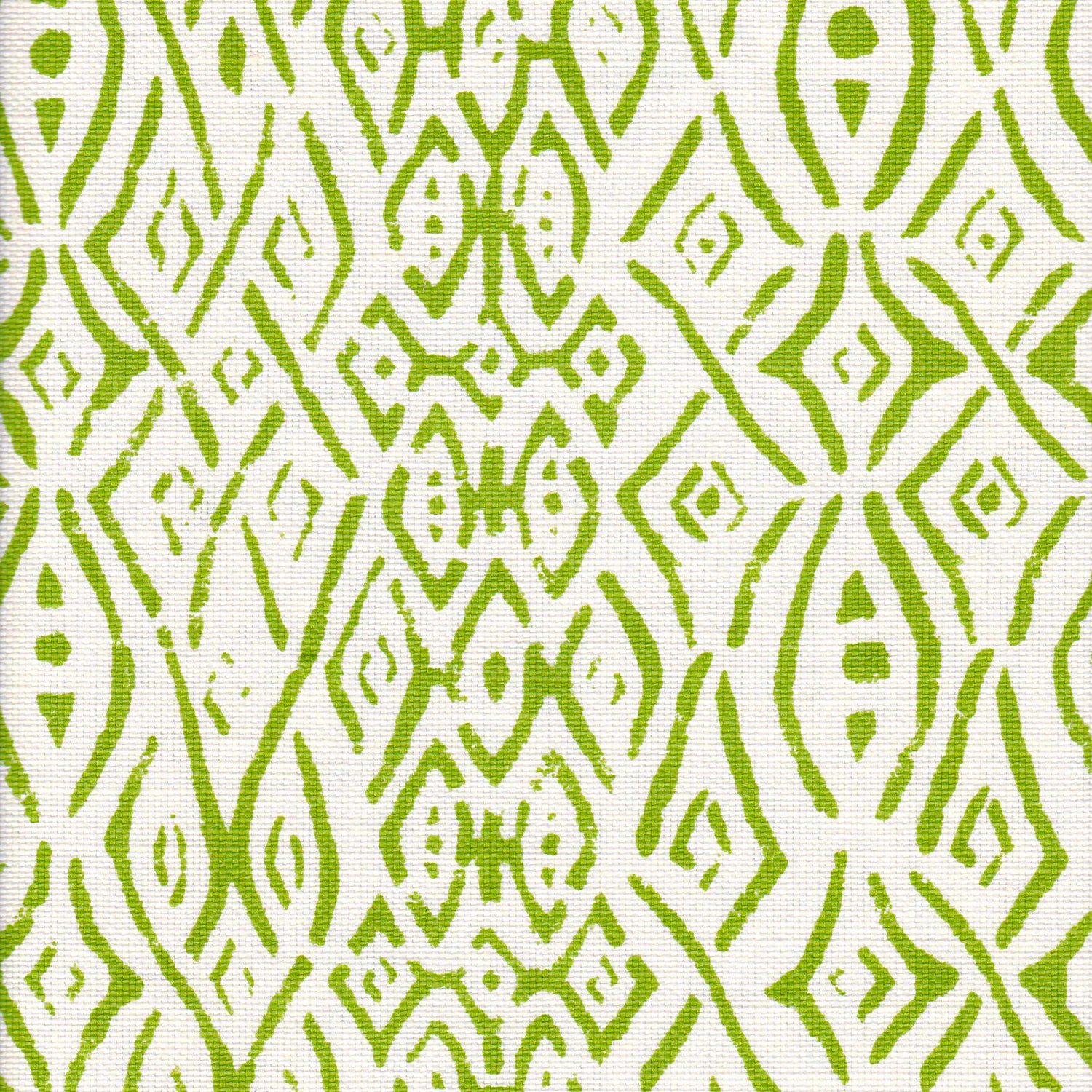 Detail of fabric in a painterly geometric grid in green on a white field.