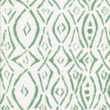 Detail of fabric in a painterly geometric grid in teal on a white field.