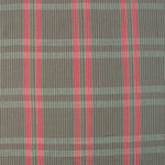 Handwoven fabric detail in a subtle window pane plaid in shades of red, pink, brown and cream. 