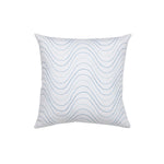 Square throw pillow with an undulating embroidery pattern in shades of blue on a white field.