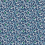 Detail of fabric in a playful irregular botanical print in green, blue and navy on a white field.