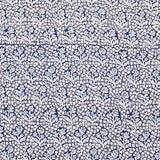 Navy blue fabric with a white floral pattern