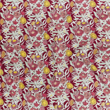 Printed linen in a hand drawn daisy design in shades of red, pink and yellow with sage leaves on a crimson field.