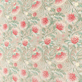 Printed fabric in a lush floral botanical design in red, pink, yellow green and turquoise on a tan field. 