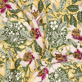 Draped fabric in a painterly orchid print in blue and tan on a navy field.