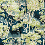 Draped fabric in a painterly tree print in shades of cream and green on a navy field.