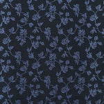 Performance fabric with a scrolling floral design in navy blue. 