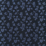 Performance fabric with a scrolling floral design in navy blue. 
