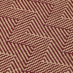 Patterned fabric with a zigzag design in red and beige.