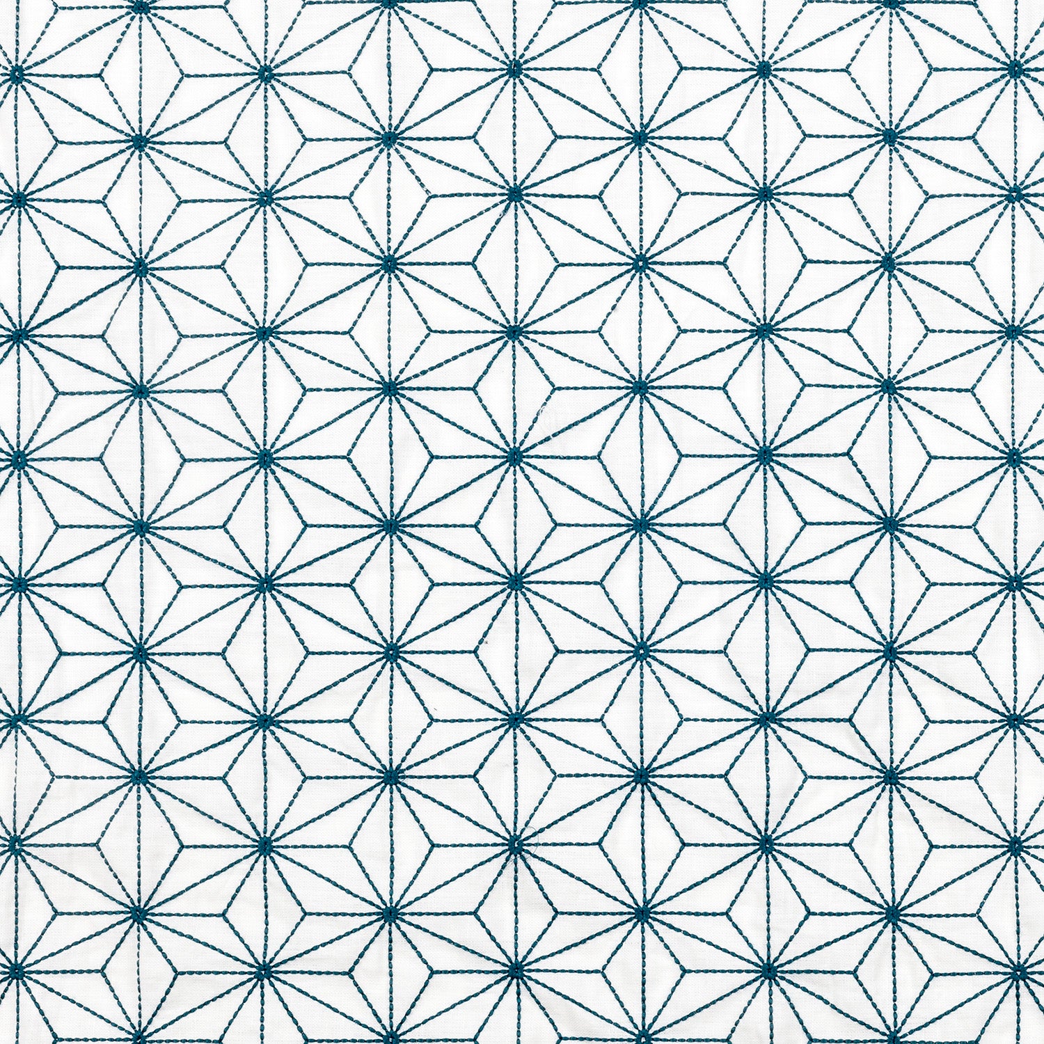 Fabric with an embroidered floral lattice print in navy on a cream field.