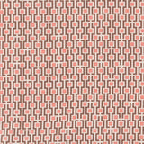 Fabric in a geometric grid print in shades of pink and brown on a tan field.