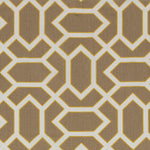 Fabric in a geometric lattice print in cream and yellow on a brown field.