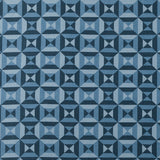 Fabric in a geometric grid print in shades of blue and navy.