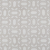 Fabric with an embroidered geometric grid print in brown on a light gray field.