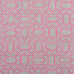 Fabric with an embroidered geometric grid print in pink on a gray field.