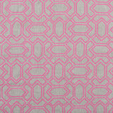 Fabric with an embroidered geometric grid print in pink on a gray field.
