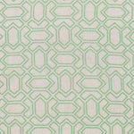 Fabric with an embroidered geometric grid print in light green on a light gray field.