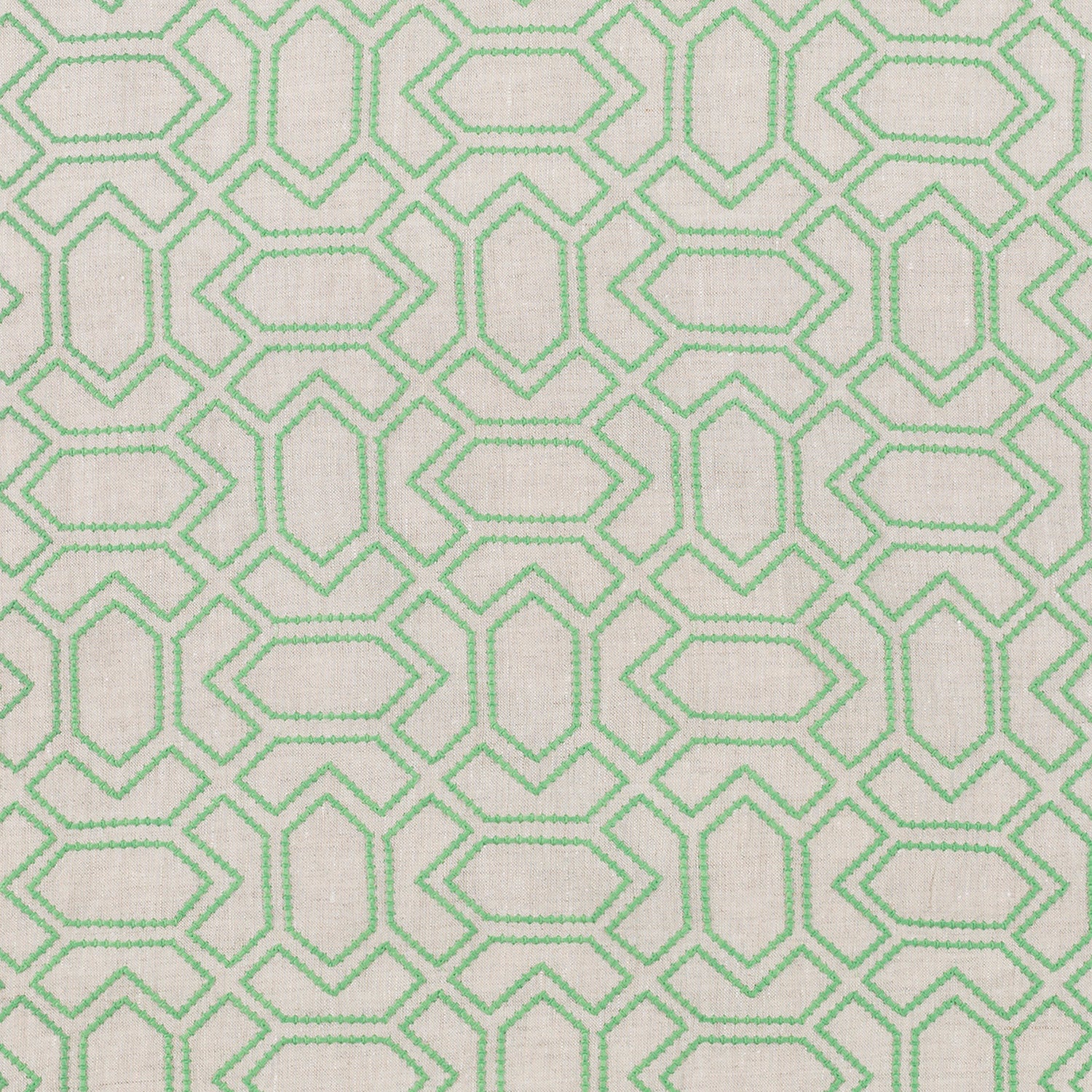 Fabric with an embroidered geometric grid print in light green on a light gray field.