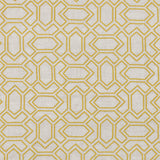 Fabric with an embroidered geometric grid print in mustard on a light gray field.