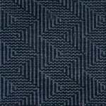Patterned carpet with a zigzag design in black and blue.