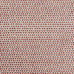 A handwoven rug with a herringbone weave in white with striated yarns of brown and red.