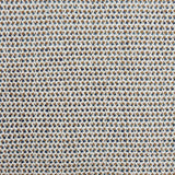 A handwoven rug with a herringbone weave in white with striated yarns of tan and marine blue. 