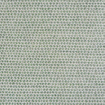 A handwoven rug with a herringbone weave in white with striated yarns in shades of light green.