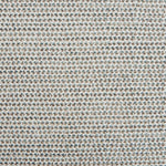 A handwoven rug with a herringbone weave in white with striated yarns of beige, gray, and muted blue-gray.