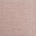 A handwoven rug with a herringbone weave in white with striated yarns of pink and red.
