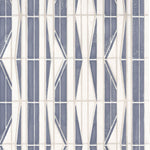Detail of wallpaper in a geometric grid print in blue, cream and white.