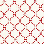 Detail of fabric in a curvilinear lattice print in red on a white field.