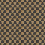 Detail of printed fabric in a watercolor ikat-inspired checkerboard pattern in muted black and warm tan.